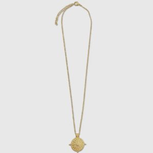 A gold necklace with a square pendant on it.
