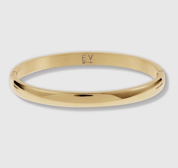 A gold bangle is shown with the word " ex ".