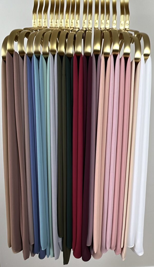 A close up of many different colored curtains