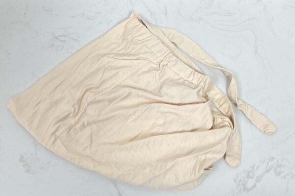 A white cloth with some brown lines on it