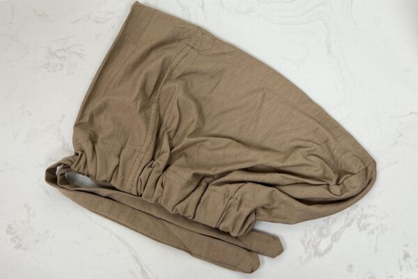 A brown cloth is folded on the table